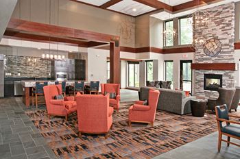 A large lobby with chairs and couches